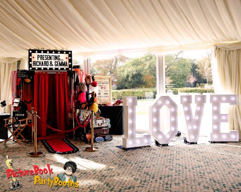 Our Hollywood Booth with L O V E letters - PictureBook PartyBooths