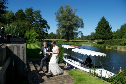 Bride and Groom stepping off Kathleen - Le Talbooth