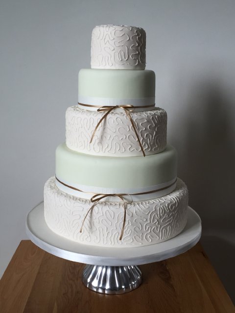 White piped and pale green 5 tier - The Cake Story