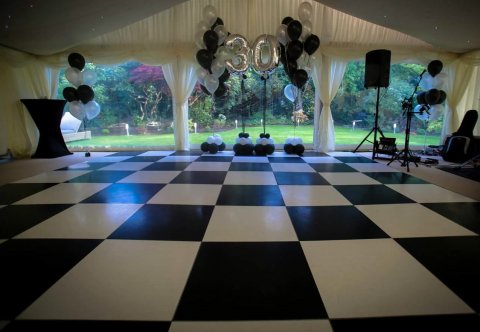 Black and white as well as wooden dance floors - Southern Furniture Hire