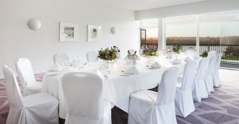 Lovely set up in one of wedding rooms for a meal overlooking the lawns adn lake - Crowne Plaza Marlow