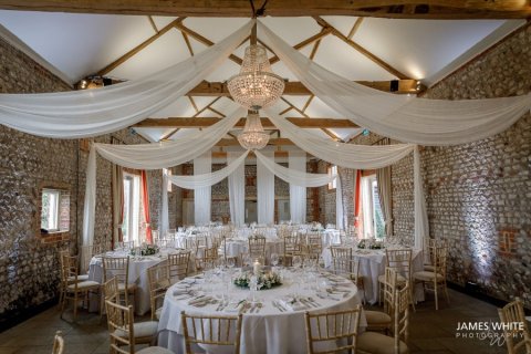 Beam drapes and glass swag chandeliers at Farbridge Barns, photography by James White Photography - Mrs