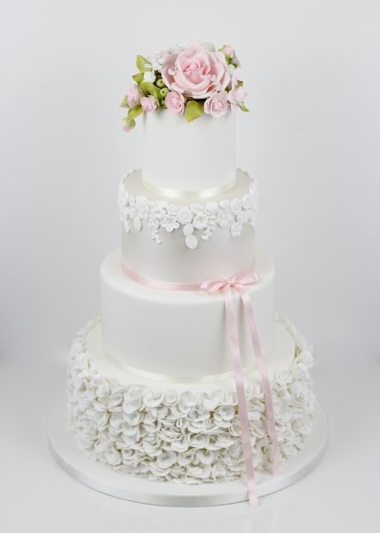 Scrunched ruffles with a lustred tier and a full sugar-flowers rose topper - Fay's cakes