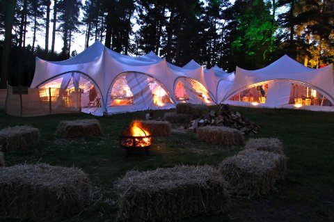 A trapze marquee at night - My Festival Wedding