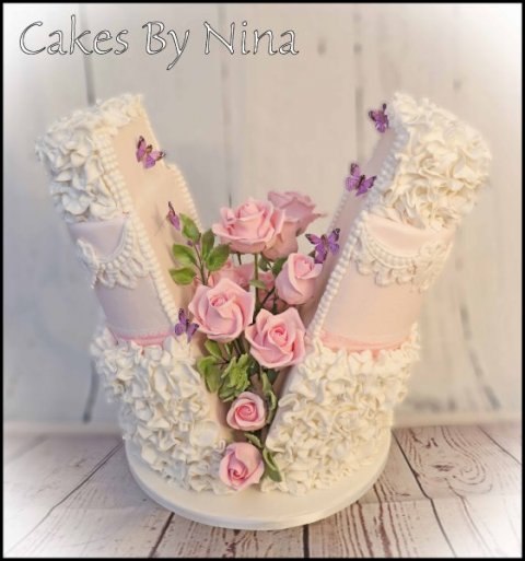 Sugar Rose Explosion, flowers are in the heart of the cake pulling to two halves together - Cakes by Nina