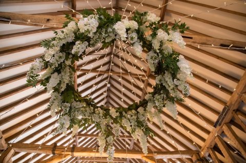 Hoop and plank floral chandelier with artificial wisteria, and star-shaped pealight canopy - Mrs