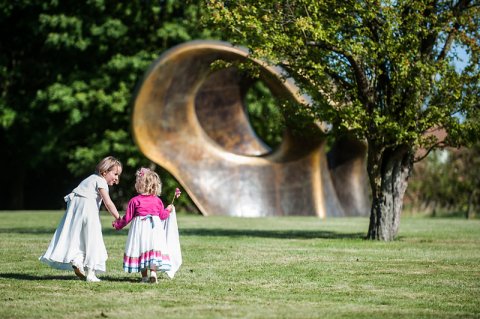 Wedding guests play by Henry Moore 'Double Oval' - Henry Moore Studios & Gardens