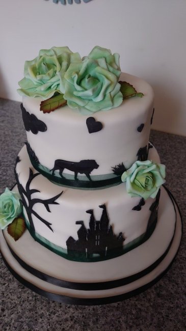 Disney themed birthday cake with handmade sugar flowers. - Speciality-Cakes