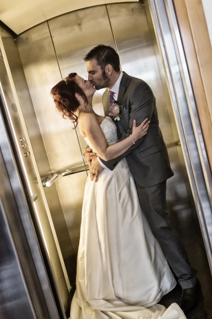 Bride & Groom alone in lift - PB Photography