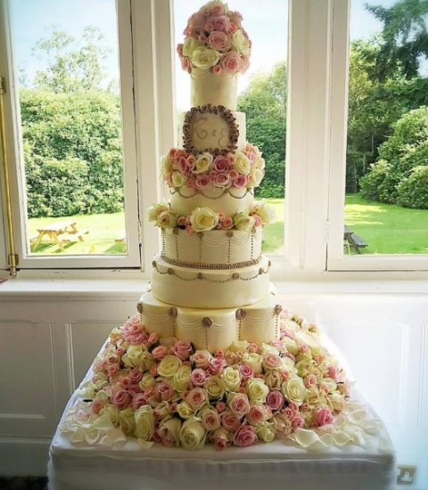 7 tier fresh rose wedding cake - Calley's Cakes