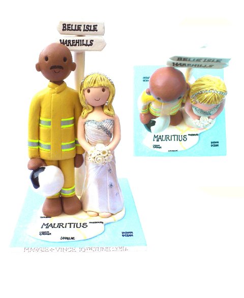 Map and fireman cake topper - Atop of the tier