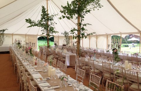 Interior Kingsley canvas with long tables and Limed washed chairs - FOUR SEASONS MARQUEES LIMITED 