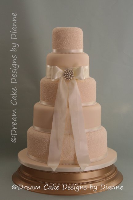 5 Tier Ivory/Cream Wedding Cake with satin and voile bow with a diamante and pearl brooch and delicate hand piped filigree detail - Dream Cake Designs (Dianne Stanley)