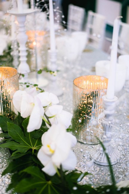 Mixed metallic candle lit banquet style wedding table styling - Pamella Dunn Events