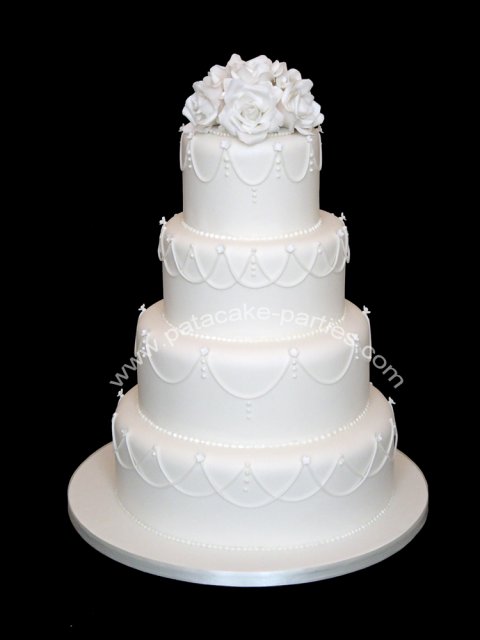 White on white wedding cake with hand-made sugar flowers - Pat-a-Cake Parties