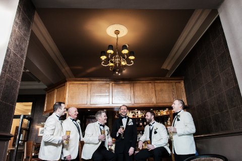 The Grooms Men enjoying a pint at Tern Hill Hall - Ben Fones Photography