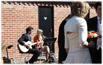 Performing for Kirsty and Sotirios during their wedding drinks reception - Taylormade Acoustic Duo