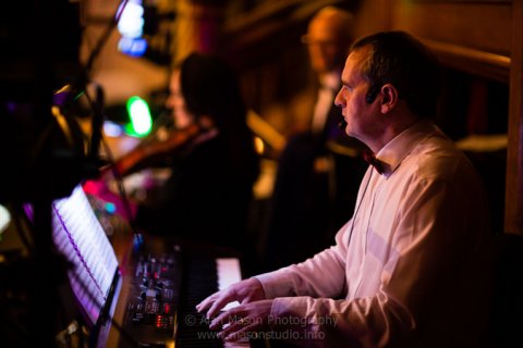 Ceilidh Knights caller (Gordon) calling instructions while playing keyboards at Matfen Hall, Northumberland - Ceilidh Knights band and DJ