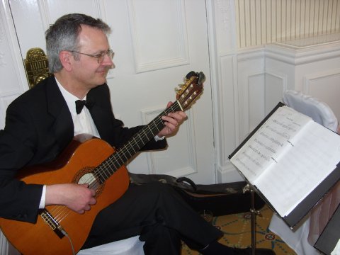 Playing live during the wedding ceremony on guitar - Carillon Flute & Guitar Duo