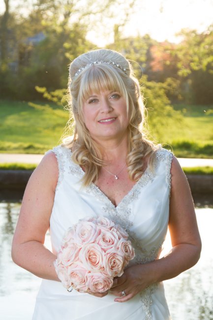 Gorgeous bride, backlit by the sun, down by the river - Narshada Photography