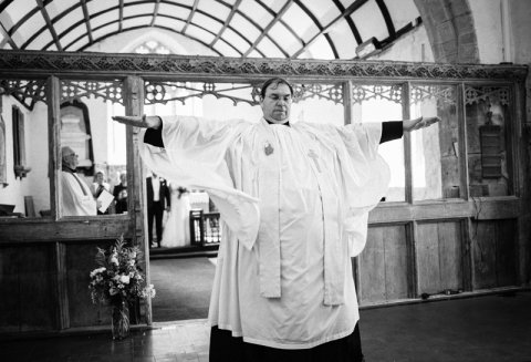 A rather eccentric vicar during the wedding ceremony - Ketch 22 photography