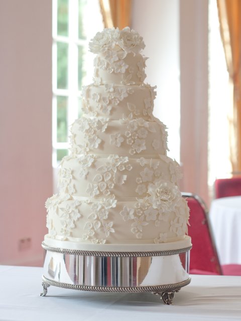 Elegant five tier wedding cake with cascading ivory sugar flowers - Rebecca Gilmore Wedding Cakes