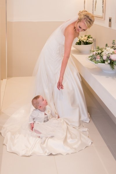 Bride with baby at Storrs Hall wedding - Simon Hughes Photography