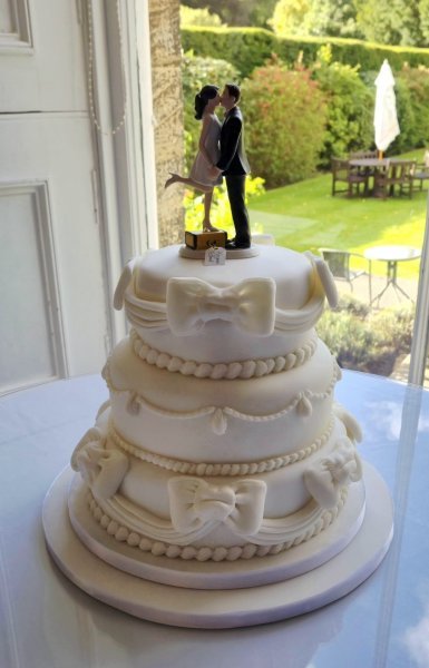 3 tier cake with bows and swags - Speciality-Cakes