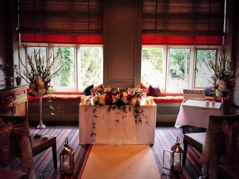 The Norman Shaw room set for a ceremony, overlooking the hotel garden - Jesmond Dene House Hotel and Restaurant