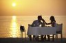 Beach dining with couple at sunset.jpg