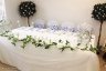 Top-Table-Swags-with-Cream-Flower-Garland.jpg